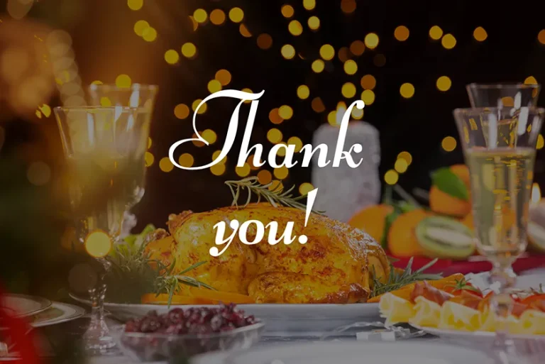 A fancy dinner spread with the words "Thank you" overlayed.