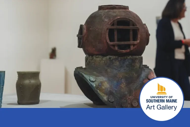An antique diving helmet rests on a table with a patron in the background.